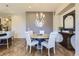 Elegant dining room with a round table, comfortable chairs, and stylish decor at 3477 New Haven Cir, Castle Rock, CO 80109