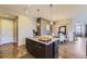 Beautiful kitchen island with granite countertops and pendant lighting, adjacent to the dining area at 3477 New Haven Cir, Castle Rock, CO 80109