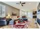Spacious living room with hardwood floors, a stylish rug, and ample seating at 3477 New Haven Cir, Castle Rock, CO 80109