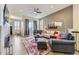 Spacious living room features hardwood floors, fireplace, comfortable seating, and an open floor plan at 3477 New Haven Cir, Castle Rock, CO 80109