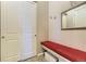 Cozy mud room with a convenient bench seat, storage, coat hooks, and mirror at 3477 New Haven Cir, Castle Rock, CO 80109