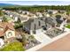 Aerial view of gray home with a well-manicured lawn and established landscaping in a suburban neighborhood at 16312 Morning Rise Ln, Monument, CO 80132