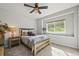 Cozy bedroom with natural light, stylish decor, carpet, and views at 16312 Morning Rise Ln, Monument, CO 80132
