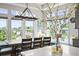 Dining area with windows and views, features table, seating, and modern lighting at 16312 Morning Rise Ln, Monument, CO 80132