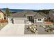 Beautiful home with a three-car garage, manicured rock garden, and attractive contrasting stone and siding accents at 16312 Morning Rise Ln, Monument, CO 80132