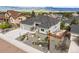 Single-story home showcasing lush landscaping, modern gray exterior, gray roof and a two car garage at 16312 Morning Rise Ln, Monument, CO 80132