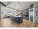 Modern kitchen featuring a large island, stainless steel appliances, and open layout to the dining area at 16312 Morning Rise Ln, Monument, CO 80132