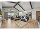 Spacious living area with vaulted ceilings, natural light, and open layout connecting to the kitchen at 16312 Morning Rise Ln, Monument, CO 80132