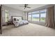 Bright main bedroom with large windows, carpet, and views at 16312 Morning Rise Ln, Monument, CO 80132