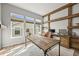 Home office with wooden desk, shelving, beams, and multiple windows with natural light at 16312 Morning Rise Ln, Monument, CO 80132