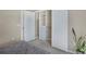 Bedroom featuring carpeted floor, closet with built-in storage, and view of the bed at 3866 S Dallas Cir # 201, Aurora, CO 80014