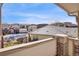 View of the community pool from the balcony featuring nearby residential buildings at 3866 S Dallas Cir # 201, Aurora, CO 80014