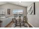 Cozy dining area with hardwood floors, and a view of the neighborhood at 3866 S Dallas Cir # 201, Aurora, CO 80014