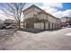 Exterior view of a multi-Gathering home featuring garages and parking areas at 3866 S Dallas Cir # 201, Aurora, CO 80014