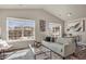 Bright living room with vaulted ceiling, hardwood floors, and large windows at 3866 S Dallas Cir # 201, Aurora, CO 80014