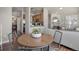 A bright and airy living space featuring dining area, hardwood floors, and modern accents at 3866 S Dallas Cir # 201, Aurora, CO 80014