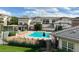 Community pool surrounded by lounge chairs and well-manicured landscaping, perfect for relaxing and enjoying the outdoors at 3866 S Dallas Cir # 201, Aurora, CO 80014