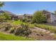 Beautiful backyard with mature trees, landscaping and stone walkway in a suburban community at 7746 S Valdai Ct, Aurora, CO 80016