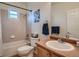 Bright bathroom featuring a shower and bathtub combination and a vanity with a sink at 7746 S Valdai Ct, Aurora, CO 80016