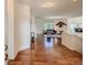 Bright foyer with hardwood floors leading into a spacious living area with lots of natural light at 7746 S Valdai Ct, Aurora, CO 80016
