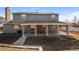 View of the home's exterior featuring a covered back patio at 17209 E Evans Dr, Aurora, CO 80013