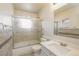 Bathroom featuring tiled shower, a toilet, a modern vanity, and ample counter space at 17209 E Evans Dr, Aurora, CO 80013