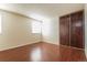 Bedroom boasts hardwood floors, double closets, and a bright window at 17209 E Evans Dr, Aurora, CO 80013