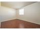 Cozy bedroom with laminate floors and a window offering natural light at 17209 E Evans Dr, Aurora, CO 80013