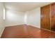 Bedroom with wood-look floors, double closets, and neutral paint at 17209 E Evans Dr, Aurora, CO 80013