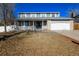 Charming two-story home with a covered porch and attached two-car garage at 17209 E Evans Dr, Aurora, CO 80013