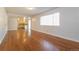 Light-filled living room featuring wood floors, white walls, and an open concept design at 17209 E Evans Dr, Aurora, CO 80013