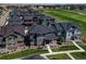 Nice aerial view of homes in a residential neighborhood near a green golf course at 16544 E 118Th Dr, Commerce City, CO 80022