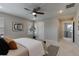 Carpeted bedroom featuring a ceiling fan, decorative accents, and natural light at 16544 E 118Th Dr, Commerce City, CO 80022