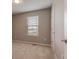 Carpeted bedroom with a window view and neutral-toned walls at 16544 E 118Th Dr, Commerce City, CO 80022