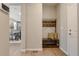 Cozy entryway with bench seating, coat rack, and a view into the adjacent dining and living areas at 16544 E 118Th Dr, Commerce City, CO 80022