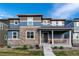 Charming two-story home with stone accents and a welcoming front porch at 16544 E 118Th Dr, Commerce City, CO 80022