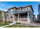 Inviting covered front porch with space to relax and enjoy the outdoors at 16544 E 118Th Dr, Commerce City, CO 80022