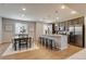 Bright kitchen featuring stainless steel appliances and a granite island with seating at 16544 E 118Th Dr, Commerce City, CO 80022