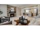 Inviting living room with fireplace, neutral decor, and open-concept design at 16544 E 118Th Dr, Commerce City, CO 80022