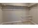 Spacious walk-in closet with shelves and rods for ample storage space at 16544 E 118Th Dr, Commerce City, CO 80022