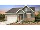 Charming craftsman-style home with a two-car garage and stone accents at 4285 Ridgewalk Pt, Castle Rock, CO 80108
