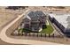 Aerial view of a grey two story house with artificial turf at 9443 Torrey Way, Arvada, CO 80007