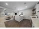 Finished basement with bar, island, living area, and neutral decor at 9443 Torrey Way, Arvada, CO 80007