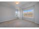 Bedroom with a large window and bright, neutral paint at 9443 Torrey Way, Arvada, CO 80007