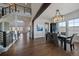 Spacious dining room with wood floors, modern chandelier, and views of the mountains at 9443 Torrey Way, Arvada, CO 80007