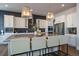 Kitchen featuring granite countertops, stainless appliances, and large island with barstool seating at 9443 Torrey Way, Arvada, CO 80007