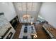 Aerial view of open-concept living room featuring a fireplace, dining area, and kitchen at 9443 Torrey Way, Arvada, CO 80007