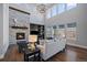 Bright living room with a stone fireplace, built-in shelves, and plenty of natural light at 9443 Torrey Way, Arvada, CO 80007