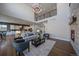 Open-concept living space with a cozy seating area and a view of the adjacent kitchen at 9443 Torrey Way, Arvada, CO 80007