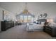 Spacious main bedroom featuring a large window, and stylish decor at 9443 Torrey Way, Arvada, CO 80007